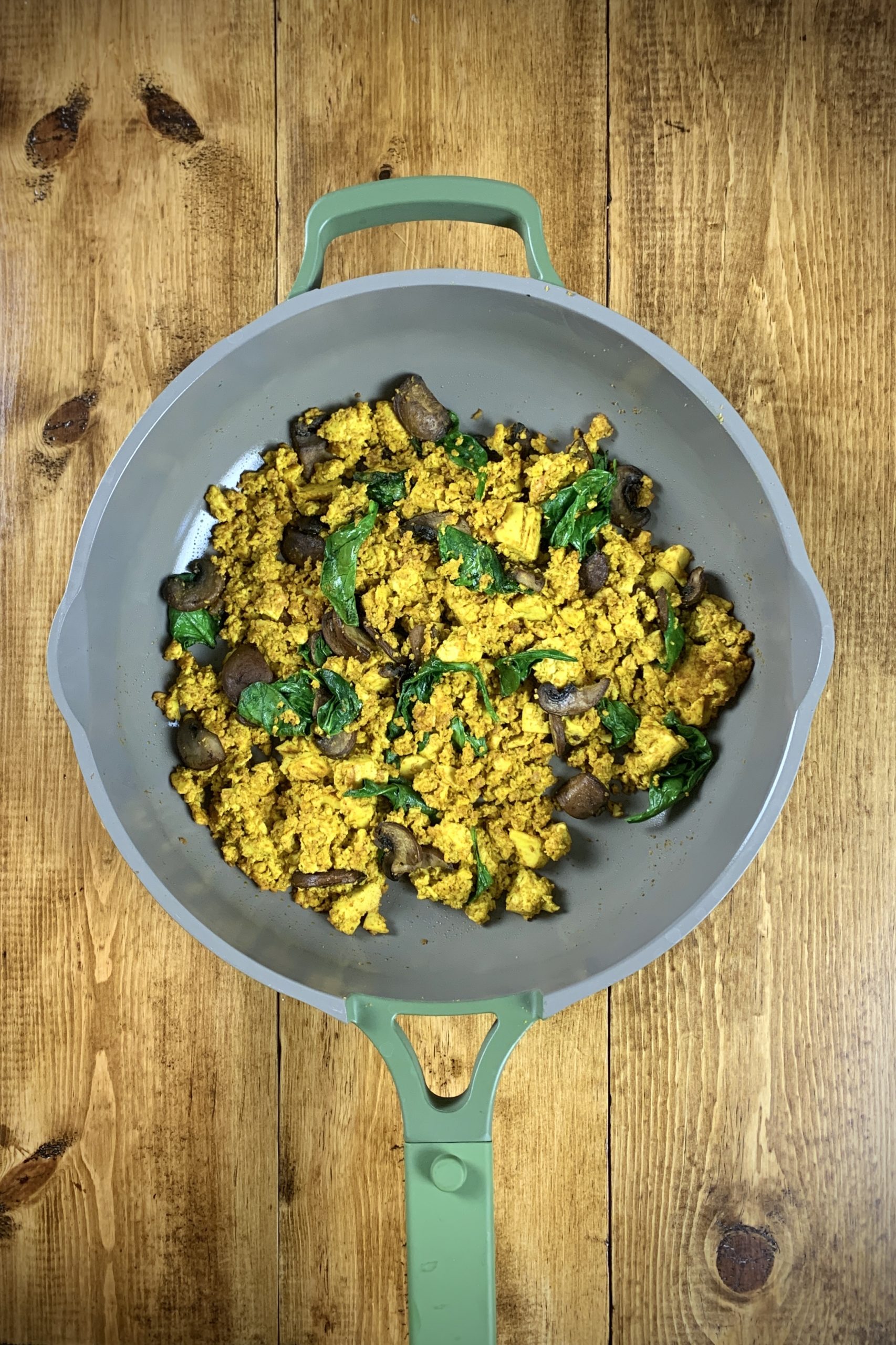 Easy Vegan Tofu Scramble in nonstick pan with spinach and mushrooms